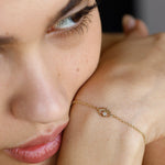 A miniature eye crafted in 14K solid gold. Delicate in scale yet rich in symbolism, it is a quiet object that bridges the visible and the unseen, balancing sculptural simplicity with meaningful design.

The symbolism of the eye has existed for thousands of years and is deeply associated with consciousness and awareness. The Evil Eye is worn for protection, the All-Seeing Eye represents divine providence, and the Third Eye symbolizes intuition, inner wisdom, and enlightenment.

The eye is a bridge between th