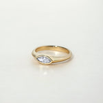FAY RING
A minimalist signet-style engagement ring where the marquise diamond becomes part of a seamless gold structure.
The FAY RING is a 14K solid gold Fine Jewelry piece that embodies softness, strength, and sculptural clarity.
Handcrafted in the Ruby Star studio as a modern heirloom engagement ring.
Details:
• 0.40ct marquise diamond (natural or lab-grown)
• Bezel setting
• 14K solid gold
• Handmade fine jewelry
• Minimal sculptural design
A luxury engagement ring for those drawn to clean lines and time