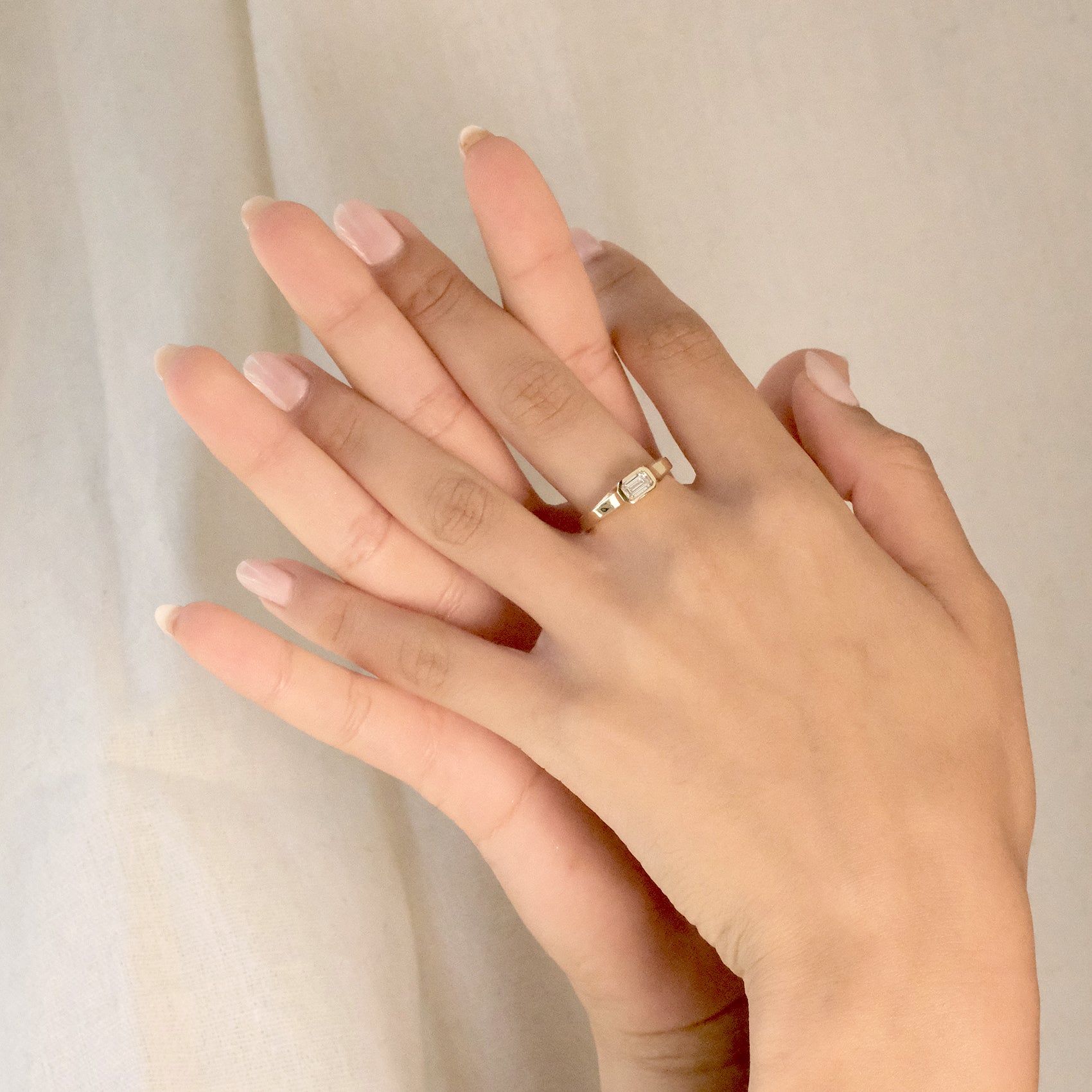 ARISE RING
An Art Deco-inspired architectural engagement ring where geometry and elegance merge. The emerald-cut diamond is framed with precision and clarity.
The ARISE RING is a 14K solid gold Fine Jewelry engagement ring designed with sculptural restraint and timeless sophistication.
Handcrafted in the Ruby Star studio as a modern heirloom.
Details:
• 0.45ct emerald-cut diamond
• Architectural bezel setting
• 14K solid gold
• Handmade fine jewelry
• Art Deco influence
A luxury emerald-cut engagement ring 