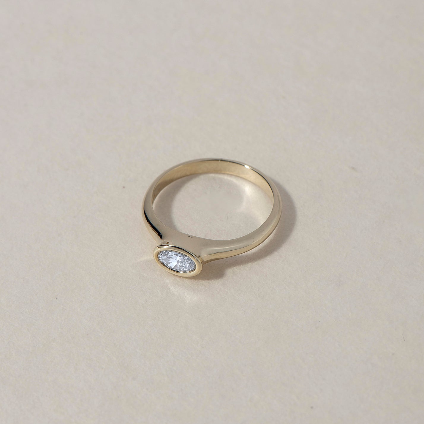 OVAL WHITE DIAMOND
A sculptural oval diamond ring where softness meets precision. The bezel setting creates a seamless flow between stone and gold.
The OVAL WHITE DIAMOND is a 14K solid gold Fine Jewelry engagement ring designed with contemporary elegance and timeless balance.
Handcrafted in the Ruby Star studio as a modern heirloom.
Details:
• Oval white diamond (natural or lab-grown)
• Bezel setting
• 14K solid gold
• Handmade fine jewelry
• Classic modern silhouette
A luxury engagement ring for those dra