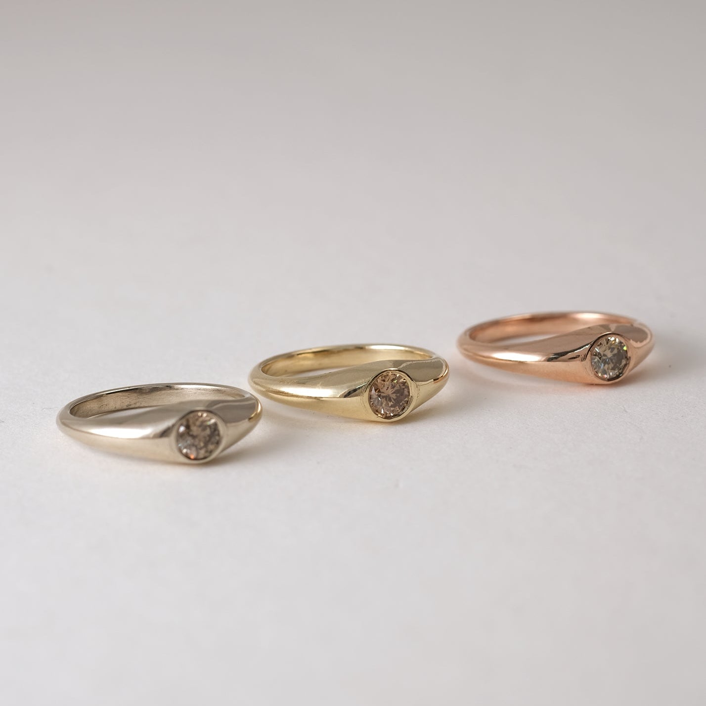 Our modern interpretation of the classic gypsy ring - soft, flowing curves with just the right amount of volume. A perfect balance of simplicity and refinement, bold yet effortless and timeless, seamlessly blending femininity and masculinity.&nbsp;

Petit Oro is set with a 0.25ct diamond of choice. Available in Natural white, Lab or champagne

Each champagne diamond is one of a kind in color, varying in a range of hues between light champagne to light brown. Therefore allow slight color variation after choo