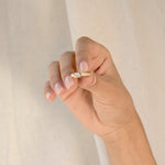 ARISE RING
An Art Deco-inspired architectural engagement ring where geometry and elegance merge. The emerald-cut diamond is framed with precision and clarity.
The ARISE RING is a 14K solid gold Fine Jewelry engagement ring designed with sculptural restraint and timeless sophistication.
Handcrafted in the Ruby Star studio as a modern heirloom.
Details:
• 0.45ct emerald-cut diamond
• Architectural bezel setting
• 14K solid gold
• Handmade fine jewelry
• Art Deco influence
A luxury emerald-cut engagement ring 