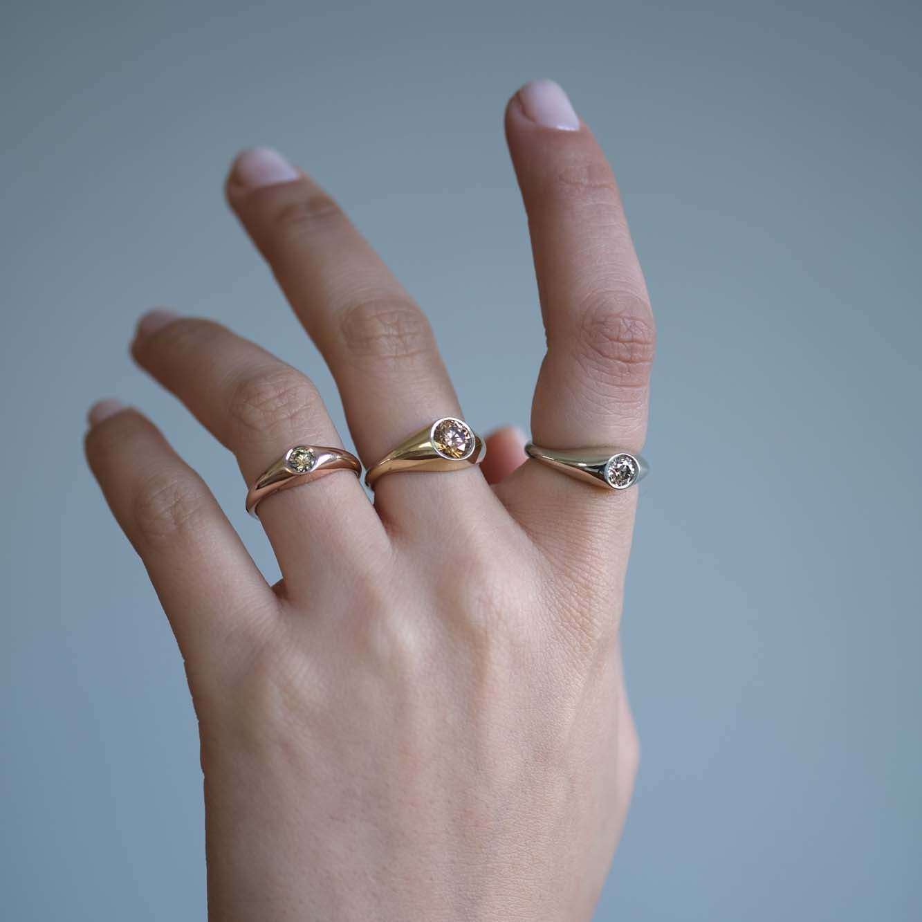 Our modern interpretation of the classic gypsy ring - soft, flowing curves with just the right amount of volume. A perfect balance of simplicity and refinement, bold yet effortless and timeless, seamlessly blending femininity and masculinity.&nbsp;

Petit Oro is set with a 0.25ct diamond of choice. Available in Natural white, Lab or champagne

Each champagne diamond is one of a kind in color, varying in a range of hues between light champagne to light brown. Therefore allow slight color variation after choo