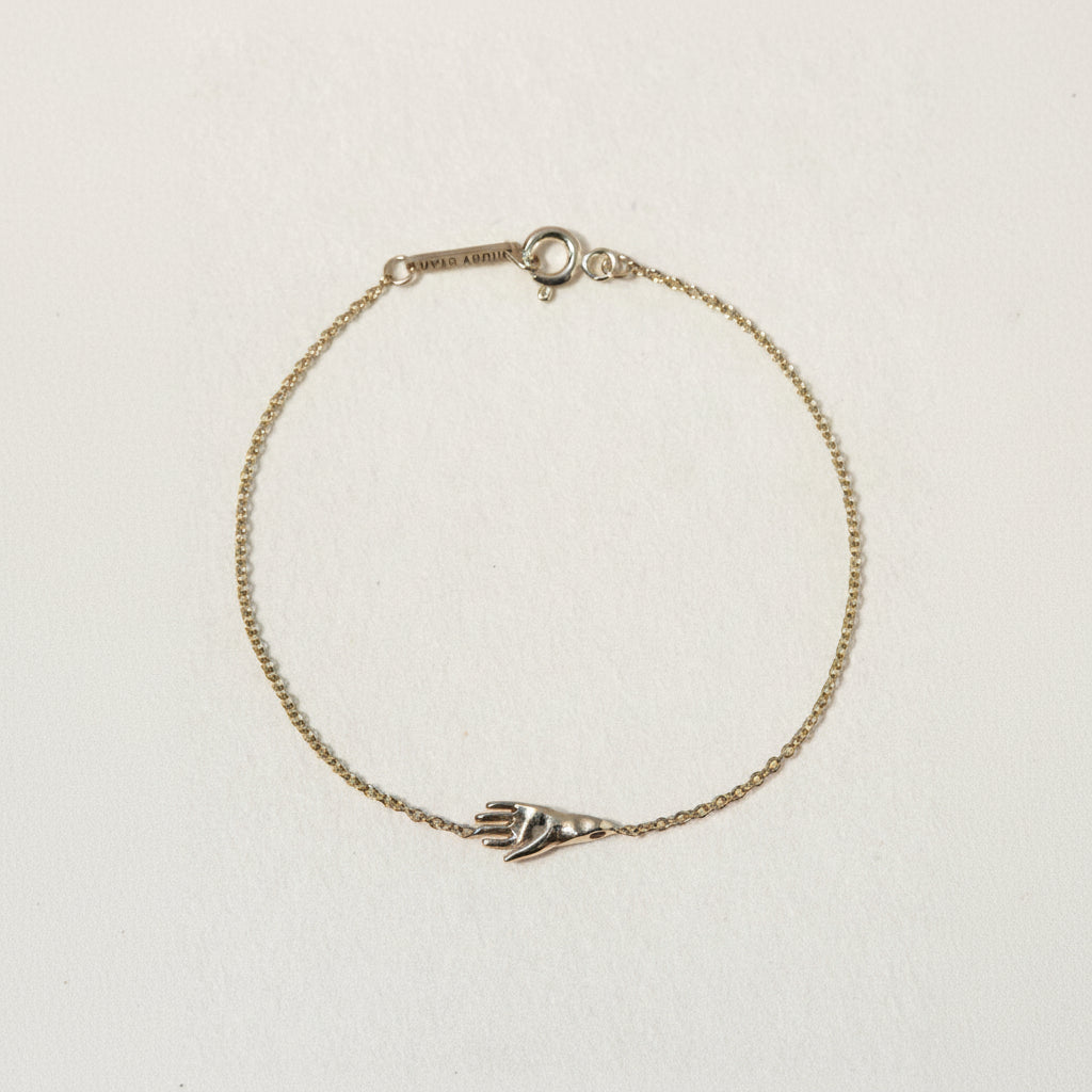 SEO TITLE

Mini Hamsa Bracelet – 14K Gold Protection Bracelet | Ruby Star Studio

META TITLE

Mini Hamsa Bracelet | 14K Gold Hand of God Protection Bracelet | Ruby Star Studio

META DESCRIPTION

A miniature Hamsa bracelet handcrafted in 14K gold. A powerful symbol of protection, strength, peace and good fortune, designed for everyday wear.

MINI HAMSA BRACELET

A protective symbol worn close to the skin.

The Mini Hamsa Bracelet is handcrafted in solid 14K gold and features the iconic Hamsa hand — an ancien