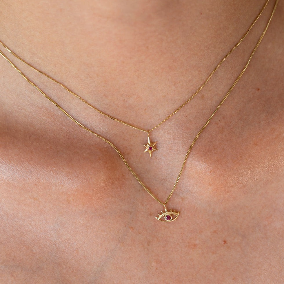 SEO TITLE

Mini Star Necklace – 14K Gold North Star Necklace | Ruby Star Studio

META TITLE

Mini Star Necklace | 14K Gold Guiding Star Necklace | Ruby Star Studio

META DESCRIPTION

A miniature North Star necklace handcrafted in 14K gold. A symbol of direction, purpose and guidance, available with a white diamond, black diamond or ruby.

MINI STAR NECKLACE

A guiding light, worn close to the heart.

The Mini Star Necklace is handcrafted in solid 14K gold and inspired by the North Star — the celestial landm