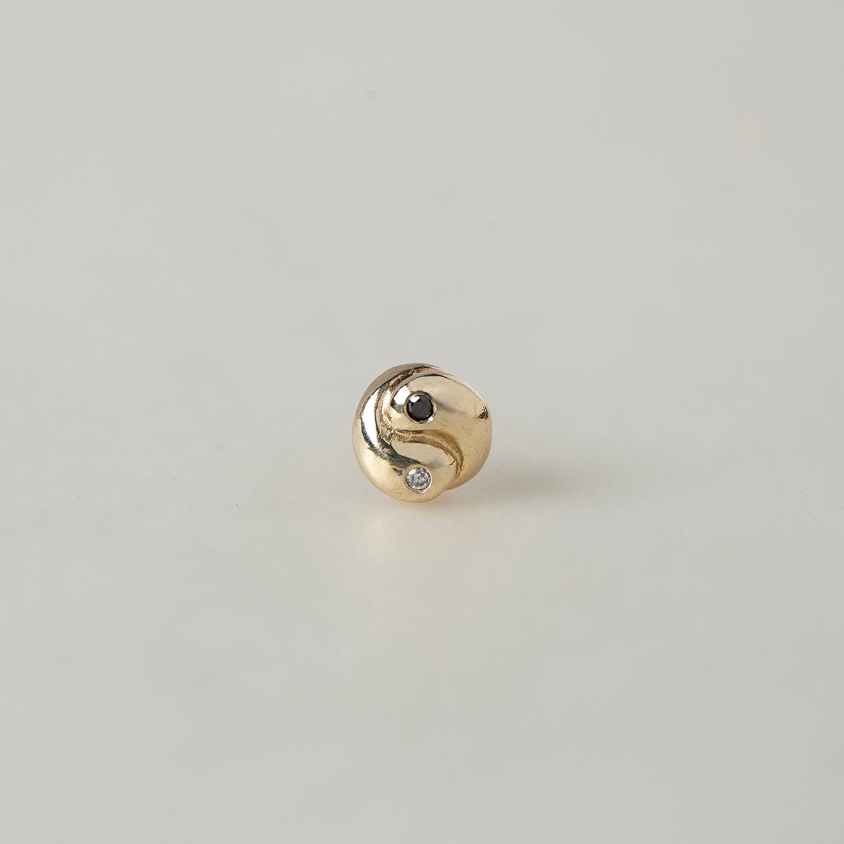 SEO TITLE

Mini Yin Yang Stud – 14K Gold Yin Yang Earring with Black & White Diamonds | Ruby Star Studio

META TITLE

Mini Yin Yang Stud | 14K Gold Balance & Harmony Earring | Ruby Star Studio

META DESCRIPTION

A miniature Yin Yang stud handcrafted in 14K gold with black and white diamonds. A symbol of balance, harmony and the union of complementary forces.

MINI YIN YANG STUD

A tiny symbol with a powerful message.

The Mini Yin Yang Stud is handcrafted in solid 14K gold and set with a white diamond and b