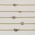 A miniature eye crafted in 14K solid gold. Delicate in scale yet rich in symbolism, it is a quiet object that bridges the visible and the unseen, balancing sculptural simplicity with meaningful design.

The symbolism of the eye has existed for thousands of years and is deeply associated with consciousness and awareness. The Evil Eye is worn for protection, the All-Seeing Eye represents divine providence, and the Third Eye symbolizes intuition, inner wisdom, and enlightenment.

The eye is a bridge between th