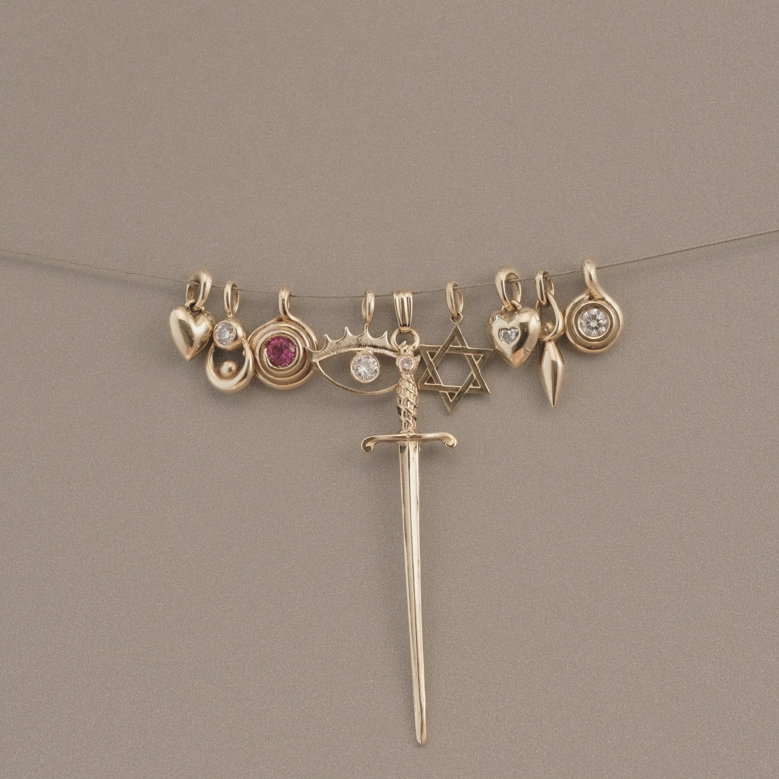 GOLD ROLL PENDANT - Ruby Star