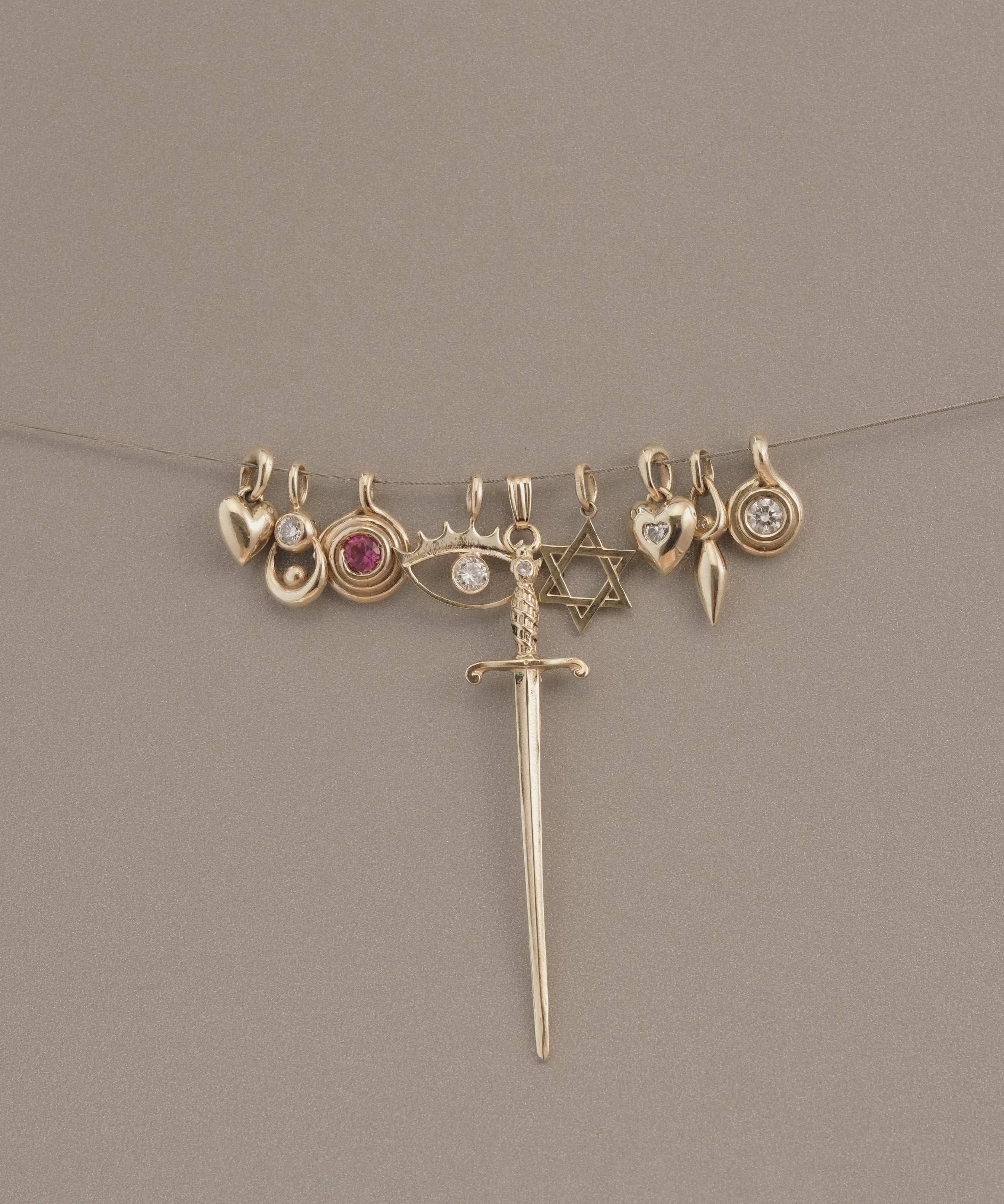 GOLD ROLL PENDANT - Ruby Star