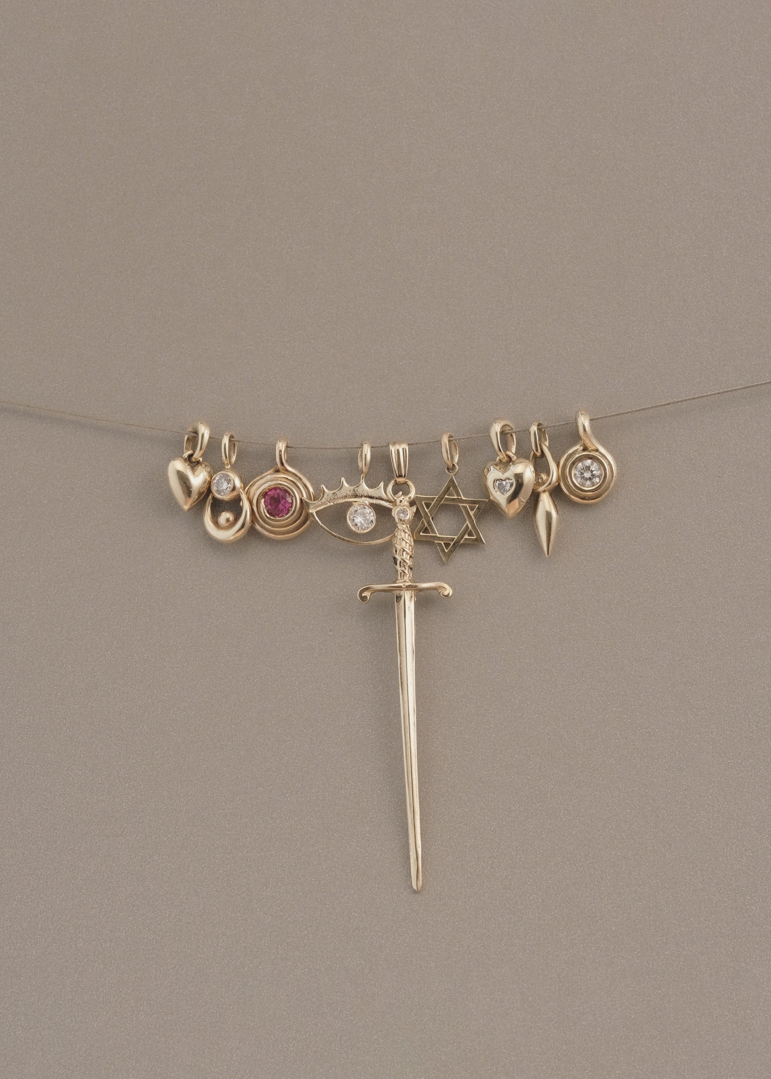 GOLD ROLL PENDANT - Ruby Star