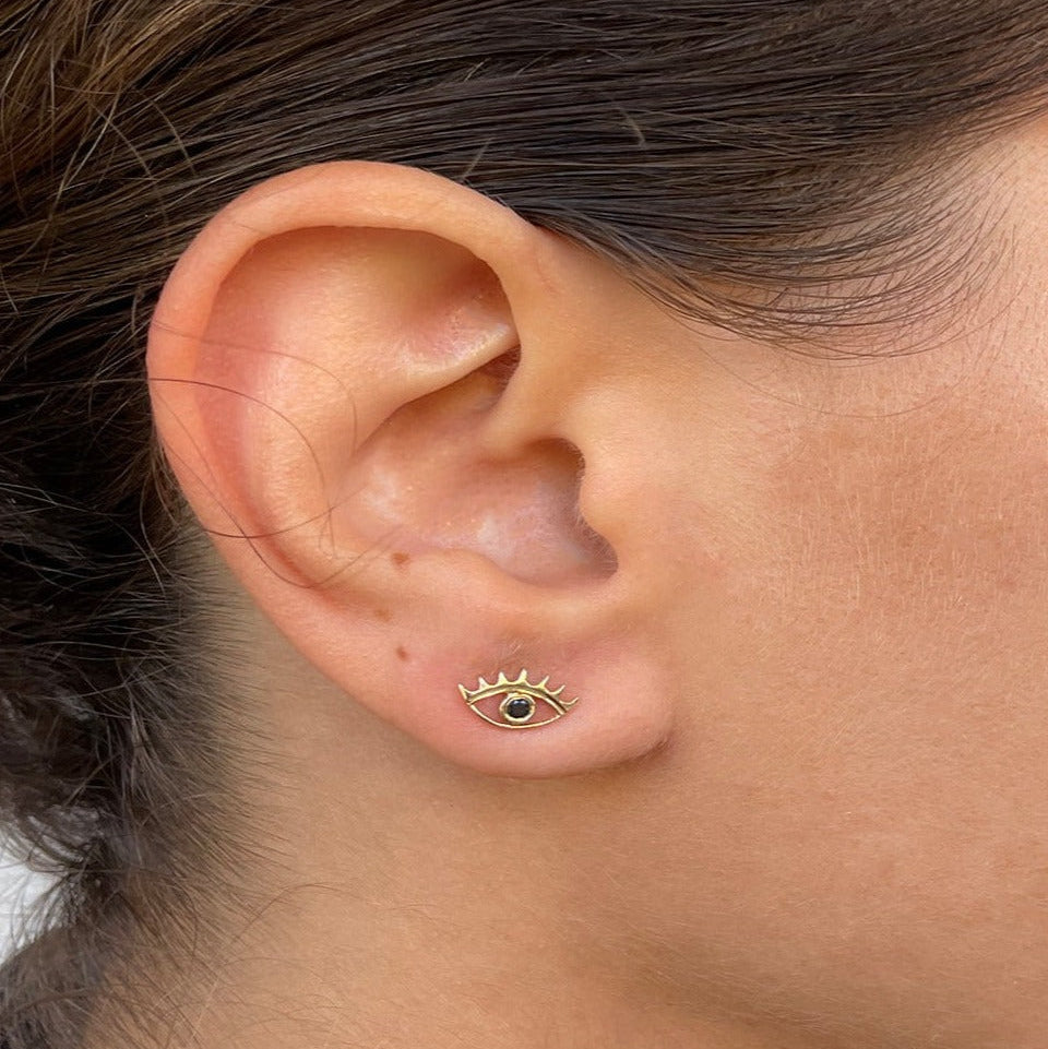 A miniature eye crafted in 14K solid gold. Delicate in scale yet rich in symbolism, it is a quiet object that bridges the visible and the unseen, balancing sculptural simplicity with meaningful design.

The symbolism of the eye has existed for thousands of years and is deeply associated with consciousness and awareness. The Evil Eye is worn for protection, the All-Seeing Eye represents divine providence, and the Third Eye symbolizes intuition, inner wisdom, and enlightenment.

The eye is a bridge between th