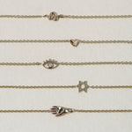 A miniature snake bracelet handcrafted in 14K solid gold. Delicate yet symbolic, it is a quiet expression of transformation, balancing sculptural simplicity with meaningful design.

Throughout history, snakes have represented fertility, creative life force, and renewal. As snakes shed their skin to survive, they remind us of our own ability to release, evolve, and begin again. They are enduring symbols of healing, rebirth, and personal transformation.

The MINI SNAKE BRACELET is a handcrafted Fine Jewelry p