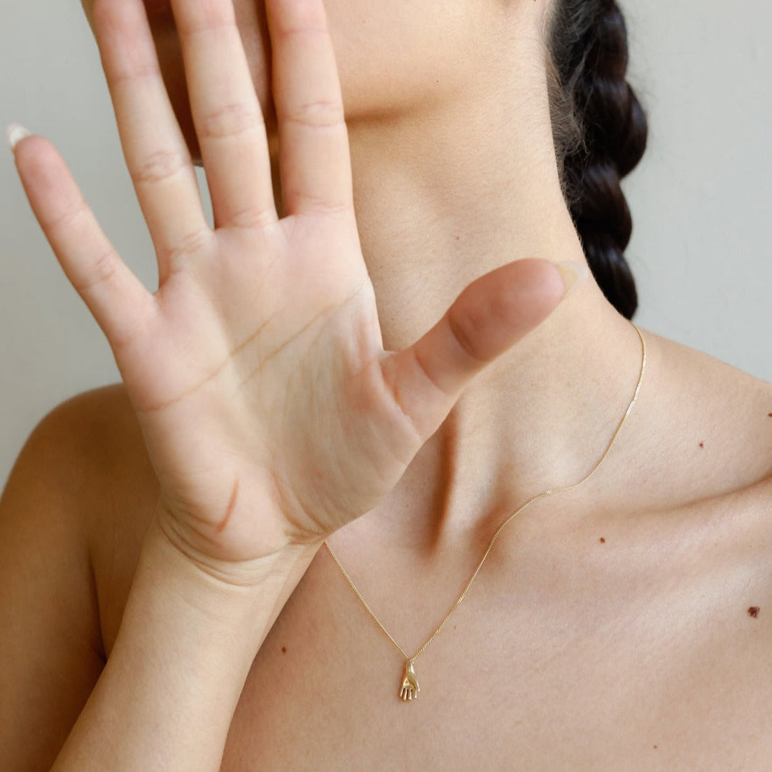 SEO TITLE

Mini Hand Necklace – 14K Gold Hamsa Necklace | Ruby Star Studio

META TITLE

Mini Hand Necklace | 14K Gold Hamsa Protection Necklace | Ruby Star Studio

META DESCRIPTION

A miniature Hamsa hand necklace handcrafted in 14K gold. A symbol of protection, strength, peace, generosity and good fortune. Fine jewelry by Ruby Star Studio.

MINI HAND NECKLACE

A timeless symbol of protection and blessing.

The Mini Hand Necklace is handcrafted in solid 14K gold and inspired by the ancient Hamsa — one of th