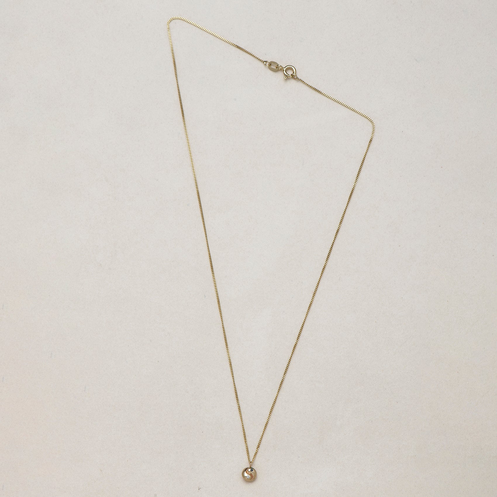 SEO TITLE

Mini Yin Yang Necklace – 14K Gold Yin Yang Necklace with Black & White Diamonds | Ruby Star Studio

META TITLE

Mini Yin Yang Necklace | 14K Gold Balance & Harmony Necklace | Ruby Star Studio

META DESCRIPTION

A miniature Yin Yang necklace handcrafted in 14K gold with black and white diamonds. A symbol of balance, harmony, love and the union of opposites.

MINI YIN YANG NECKLACE

A reminder that wholeness is found in embracing both sides of ourselves.

The Mini Yin Yang Necklace is handcrafted i