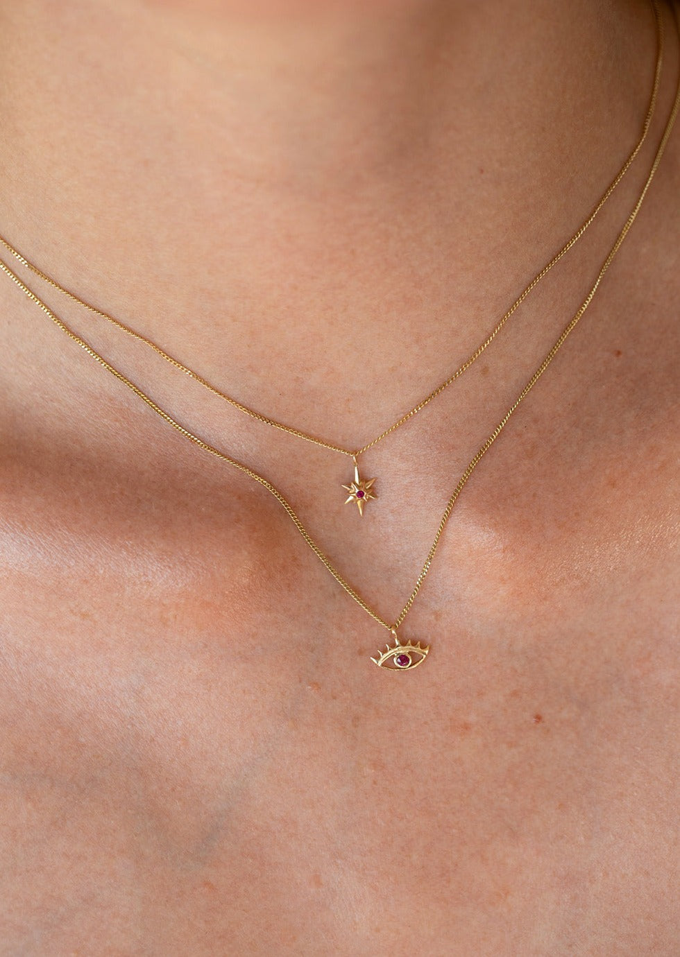 MINI EYE NECKLACE
English

A miniature eye necklace handcrafted in 14K solid gold and suspended from a delicate curb chain. Small in scale yet rich in meaning, it is a quiet symbolic object that balances sculptural simplicity with a sense of protection and inner awareness.

The symbolism of the eye has existed for thousands of years and has always been associated with consciousness and perception. The Evil Eye is worn for protection, the All-Seeing Eye represents divine providence, and the Third Eye symboli