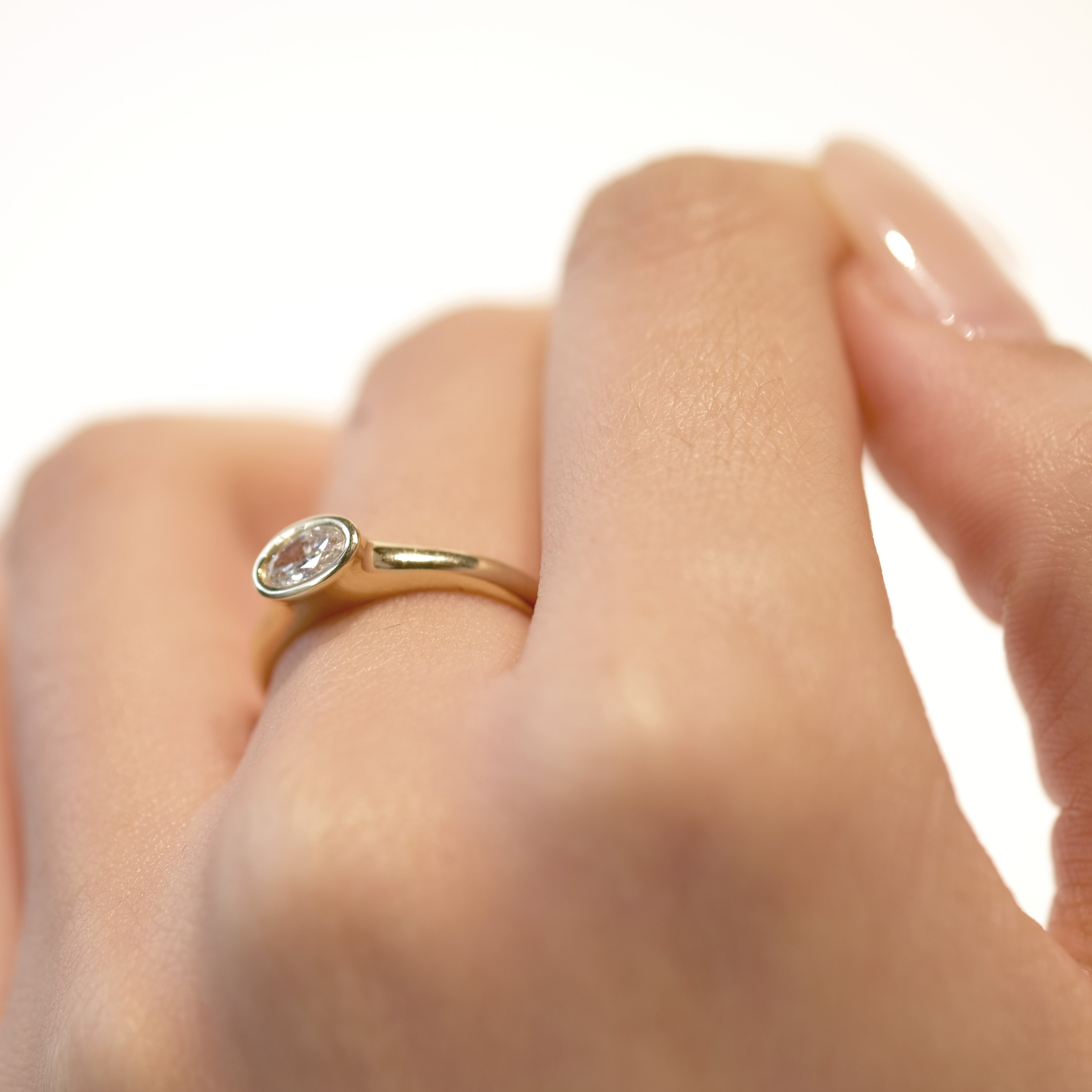 OVAL WHITE DIAMOND
A sculptural oval diamond ring where softness meets precision. The bezel setting creates a seamless flow between stone and gold.
The OVAL WHITE DIAMOND is a 14K solid gold Fine Jewelry engagement ring designed with contemporary elegance and timeless balance.
Handcrafted in the Ruby Star studio as a modern heirloom.
Details:
• Oval white diamond (natural or lab-grown)
• Bezel setting
• 14K solid gold
• Handmade fine jewelry
• Classic modern silhouette
A luxury engagement ring for those dra