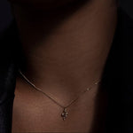 A miniature snake necklace handcrafted in 14K solid gold, suspended from a delicate curb chain. Small in scale yet rich in symbolism, it balances sculptural simplicity with quiet presence.

Throughout history, snakes have symbolized fertility, creative life force, and renewal. As snakes shed their skin to survive, they remind us of the importance of releasing what no longer serves us in order to grow and transform. They are enduring symbols of rebirth, healing, and personal evolution.

The MINI SNAKE NECKLA