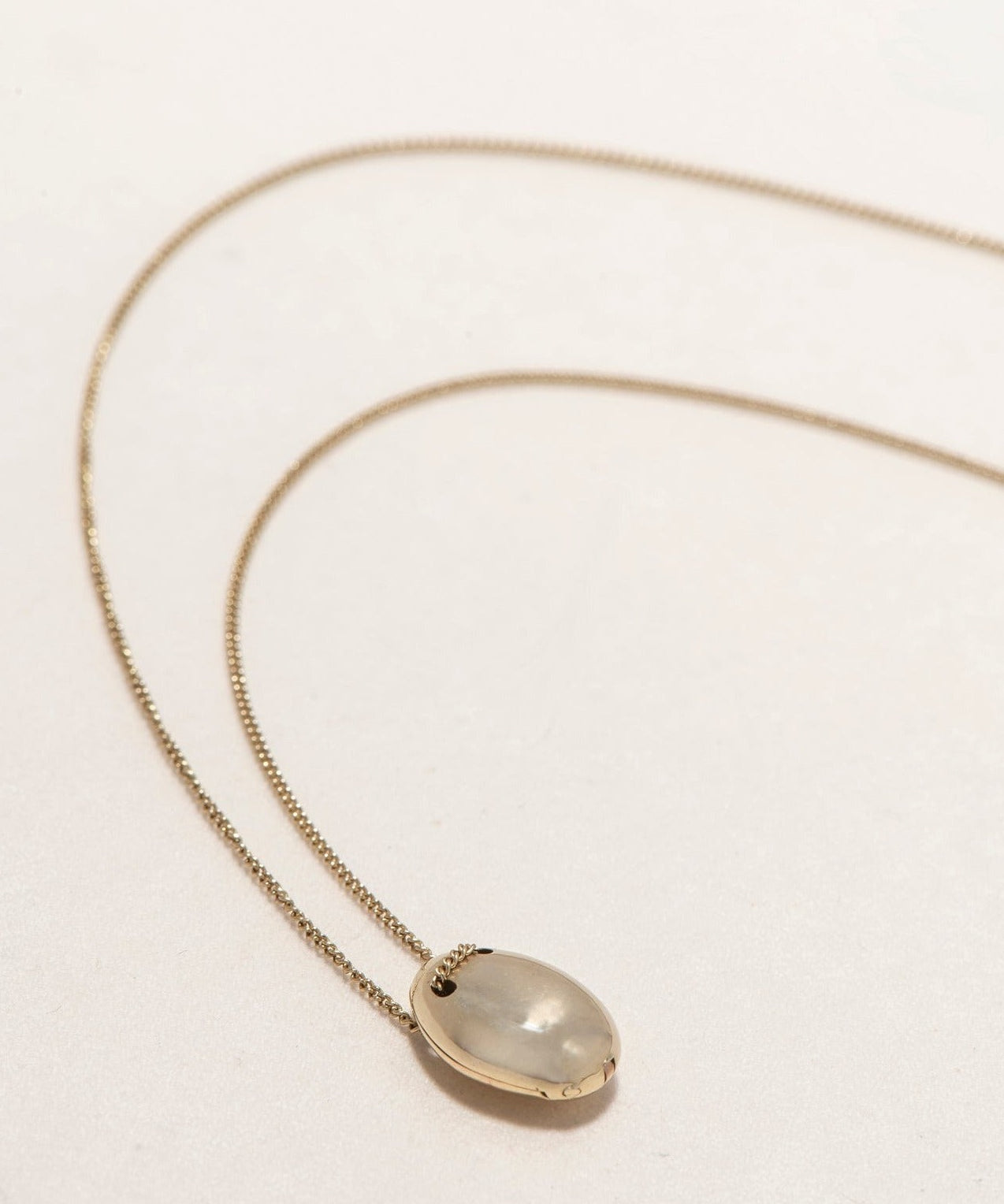 GOLD PEBBLE LOCKET - Ruby Star