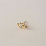 A miniature eye crafted in 14K solid gold. Delicate in scale yet rich in symbolism, it is a quiet object that bridges the visible and the unseen, balancing sculptural simplicity with meaningful design.

The symbolism of the eye has existed for thousands of years and is deeply associated with consciousness and awareness. The Evil Eye is worn for protection, the All-Seeing Eye represents divine providence, and the Third Eye symbolizes intuition, inner wisdom, and enlightenment.

The eye is a bridge between th