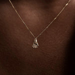 SEO TITLE

Mini Hand Necklace – 14K Gold Hamsa Necklace | Ruby Star Studio

META TITLE

Mini Hand Necklace | 14K Gold Hamsa Protection Necklace | Ruby Star Studio

META DESCRIPTION

A miniature Hamsa hand necklace handcrafted in 14K gold. A symbol of protection, strength, peace, generosity and good fortune. Fine jewelry by Ruby Star Studio.

MINI HAND NECKLACE

A timeless symbol of protection and blessing.

The Mini Hand Necklace is handcrafted in solid 14K gold and inspired by the ancient Hamsa — one of th