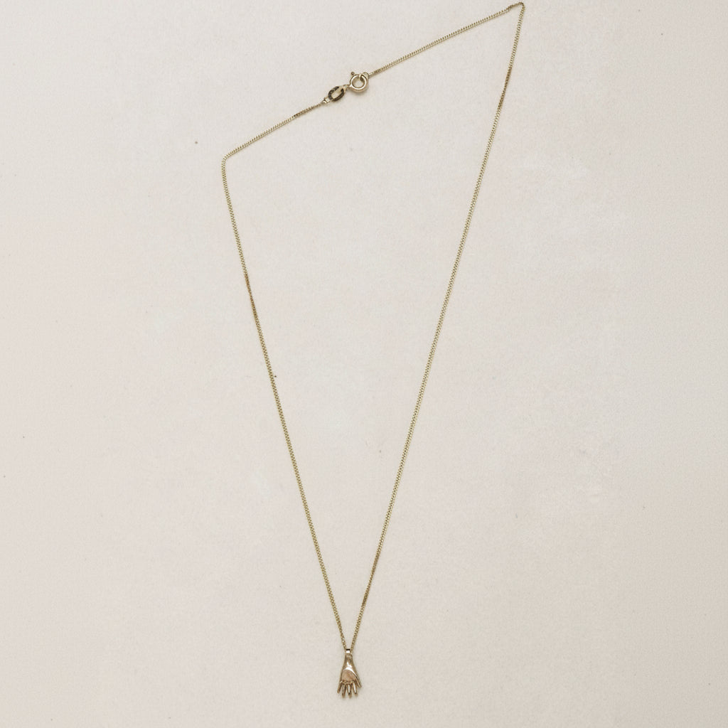 SEO TITLE

Mini Hand Necklace – 14K Gold Hamsa Necklace | Ruby Star Studio

META TITLE

Mini Hand Necklace | 14K Gold Hamsa Protection Necklace | Ruby Star Studio

META DESCRIPTION

A miniature Hamsa hand necklace handcrafted in 14K gold. A symbol of protection, strength, peace, generosity and good fortune. Fine jewelry by Ruby Star Studio.

MINI HAND NECKLACE

A timeless symbol of protection and blessing.

The Mini Hand Necklace is handcrafted in solid 14K gold and inspired by the ancient Hamsa — one of th