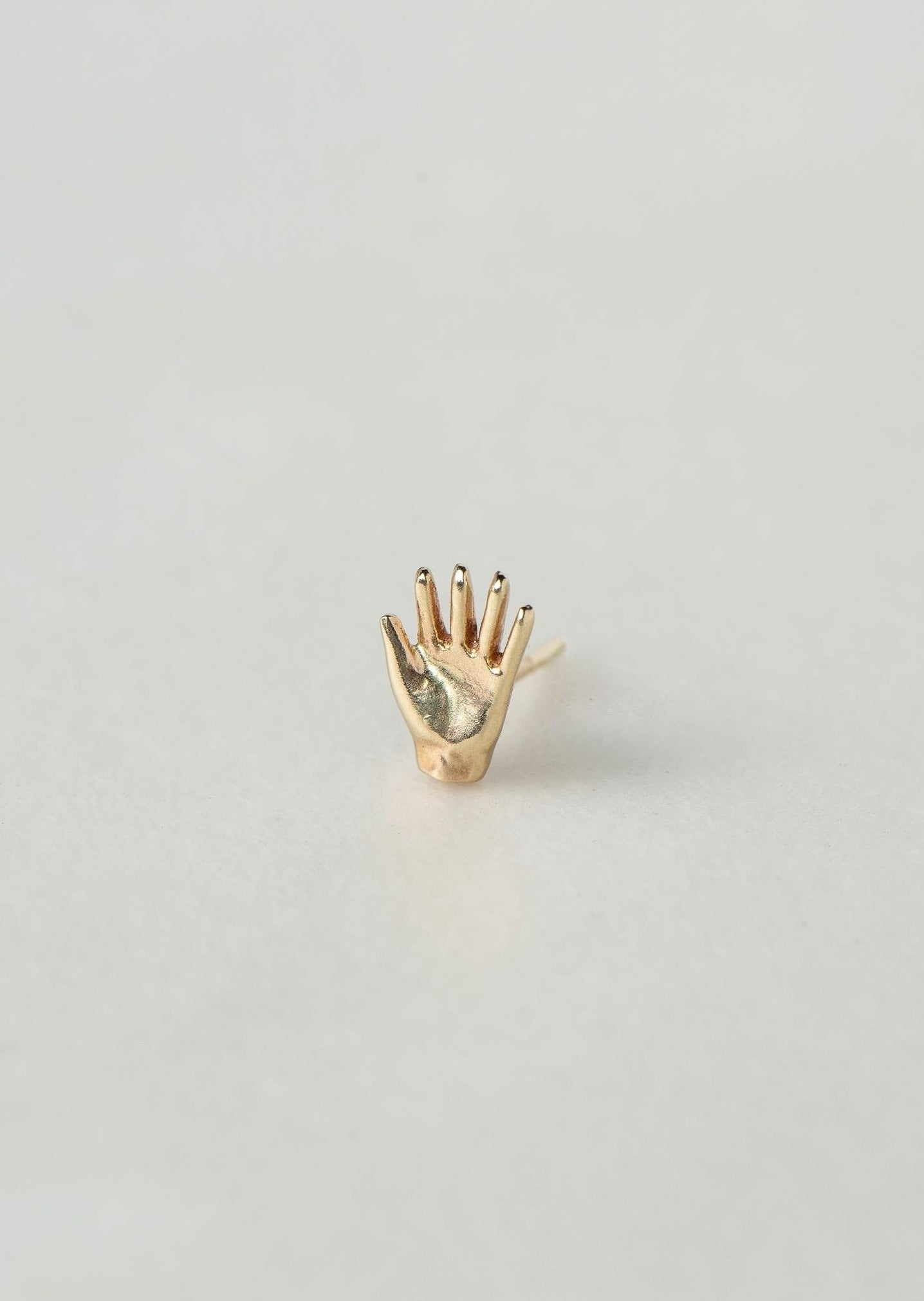 SEO TITLE

Mini Hand Stud – 14K Gold Hamsa Stud Earring | Ruby Star Studio

META TITLE

Mini Hand Stud | 14K Gold Hamsa Protection Earring | Ruby Star Studio

META DESCRIPTION

A miniature Hamsa hand stud handcrafted in 14K gold. A symbol of protection, strength, generosity and good fortune. A timeless everyday talisman.

MINI HAND STUD

A small talisman of protection, strength and blessing.

The Mini Hand Stud is handcrafted in solid 14K gold and inspired by the ancient Hamsa — also known as the Hand of Go