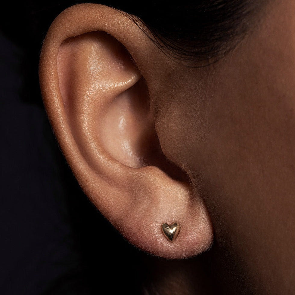 SEO TITLE

Mini Heart Stud – 14K Gold Heart Earring | Ruby Star Studio

META TITLE

Mini Heart Stud | 14K Gold Symbolic Earring | Ruby Star Studio

META DESCRIPTION

A miniature 14K gold heart stud symbolizing love, compassion and emotional wisdom. Handcrafted fine jewelry designed for everyday wear.

MINI HEART STUD

A tiny heart with enduring meaning.

The Mini Heart Stud is handcrafted in solid 14K gold and designed as a delicate everyday talisman. Measuring just 5.5 mm, this miniature heart carries one 