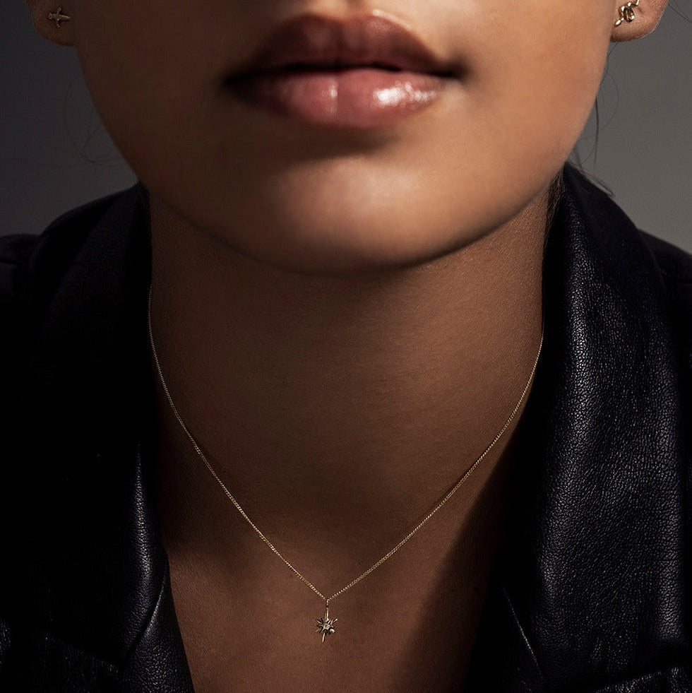 SEO TITLE

Mini Star Necklace – 14K Gold North Star Necklace | Ruby Star Studio

META TITLE

Mini Star Necklace | 14K Gold Guiding Star Necklace | Ruby Star Studio

META DESCRIPTION

A miniature North Star necklace handcrafted in 14K gold. A symbol of direction, purpose and guidance, available with a white diamond, black diamond or ruby.

MINI STAR NECKLACE

A guiding light, worn close to the heart.

The Mini Star Necklace is handcrafted in solid 14K gold and inspired by the North Star — the celestial landm