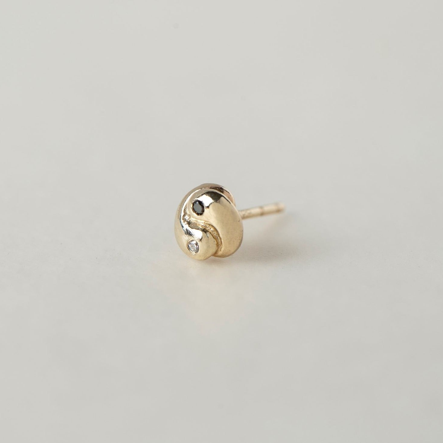 SEO TITLE

Mini Yin Yang Stud – 14K Gold Yin Yang Earring with Black & White Diamonds | Ruby Star Studio

META TITLE

Mini Yin Yang Stud | 14K Gold Balance & Harmony Earring | Ruby Star Studio

META DESCRIPTION

A miniature Yin Yang stud handcrafted in 14K gold with black and white diamonds. A symbol of balance, harmony and the union of complementary forces.

MINI YIN YANG STUD

A tiny symbol with a powerful message.

The Mini Yin Yang Stud is handcrafted in solid 14K gold and set with a white diamond and b